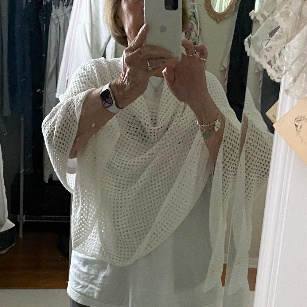 White poncho.  Light weight. Great toss on for a light cover